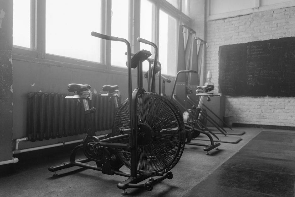 Interior of the FORGE training studio with free weights and industrial design.